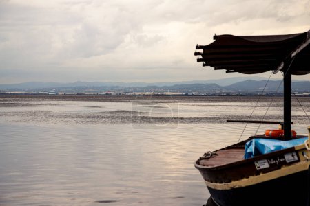 Photo for Cloudy day in the Albufera, the boats are moored - Royalty Free Image