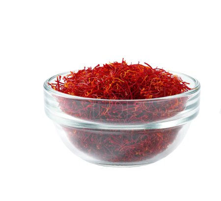 Photo for Saffron thread in a clear glass bowl isolated on white background. - Royalty Free Image
