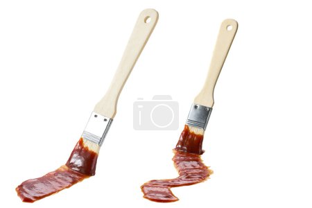 Photo for Barbecue brush with a wooden handle isolated on white background. Barbecue sauce and brush. Basting brush with barbecue sauce isolated. Grill sauce. - Royalty Free Image