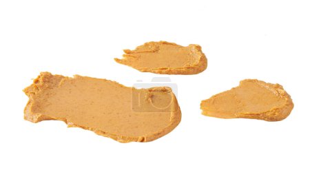 Photo for Peanut creamy paste smears or splashes of peanut butter isolated on white background. - Royalty Free Image