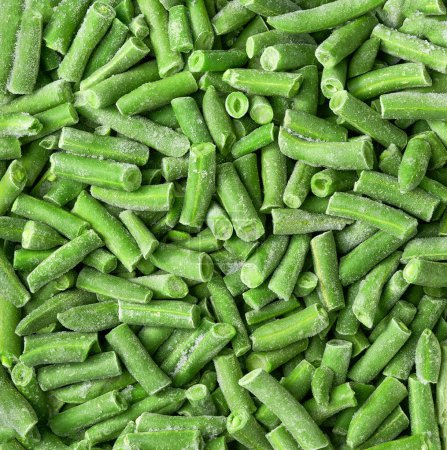 Téléchargez les photos : Légumes congelés pour cuire la texture des haricots verts. haricots congelés sont des haricots verts. - en image libre de droit