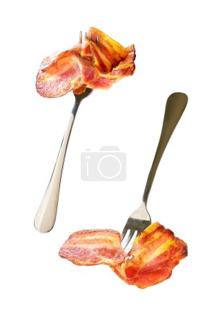 Photo for Fried bacon strips on a fork isolated on white background. - Royalty Free Image