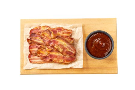 Photo for Chopping board with fried bacon rashers and bbq sauce isolated on white background, top view. Crispy rashers of streaky bacon. - Royalty Free Image