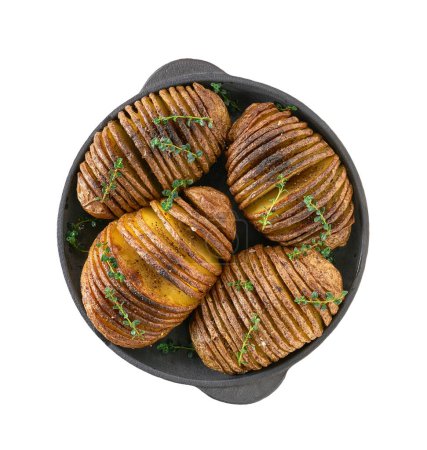 Photo for Crispy roasted hasselback potato in a iron pan isolated on white background. - Royalty Free Image