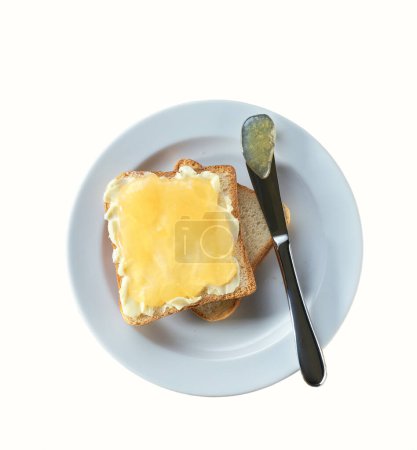 Téléchargez les photos : Toast à la confiture de gingembre savoureuse isolé sur un fond blanc. - en image libre de droit