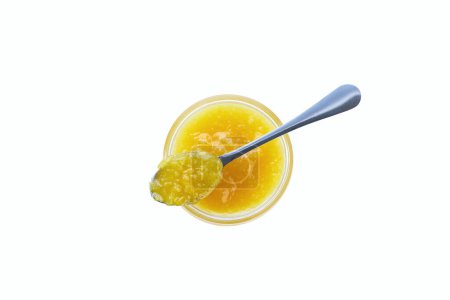 Photo for Lemon jam in jar with spoon isolated on white background, top view. Jar of lemon confiture with spoon top view, isolated on white background. - Royalty Free Image