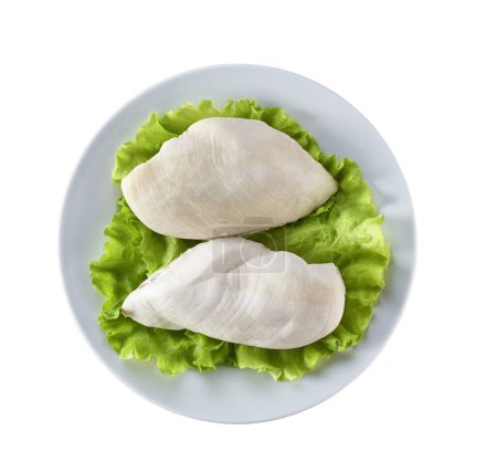 Photo for Boiled chicken breast fillet is in a white ceramic plate on a isolated on white background. Top view. - Royalty Free Image