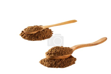 Photo for Wooden spoons filled with cinnamon powder isolated on a white background. Diagonal composition. - Royalty Free Image