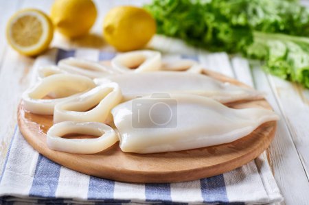 Photo for Squids rings prepared for cooking low calorie dish. Seafood concept. - Royalty Free Image