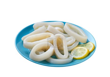 Photo for Raw squid rings on a blue plate  isolated on a white background. Squid cut into rings on a plate isolated. Sliced rings raw calamari . - Royalty Free Image