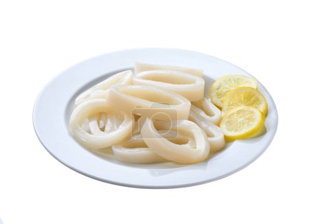 Photo for Fresh squid rings in a white plate  isolated on a white background. Seafood concept. Squid cut into rings on a plate isolated. Sliced rings raw calamari . - Royalty Free Image