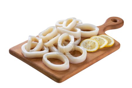 Photo for Fresh squid rings on a cutting board isolated on a white background - Royalty Free Image