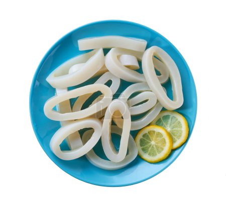 Photo for Raw squid rings on a blue plate  isolated on a white background, top view. Squid cut into rings on a plate isolated. Sliced rings raw calamari . - Royalty Free Image