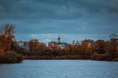 Photo for View of the lake and church in the fall - Royalty Free Image