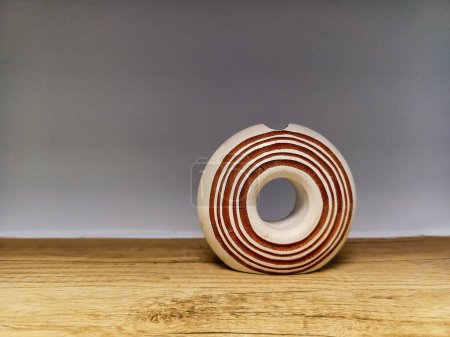 Striped circle handicraft made of wood as home decoration