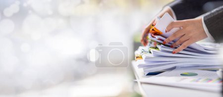 Photo for Business Documents, Auditor businesswoman checking searching document legal prepare paperwork or report for analysis TAX time,accountant Documents data contract partner deal in workplace office - Royalty Free Image