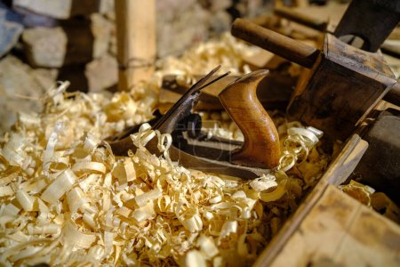 Photo for Woodworking concept. Sawdust and a hand planer in chips. - Royalty Free Image
