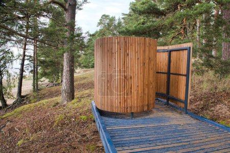 Photo for Beach dressing room. A modern bathing place to change clothes at Lake Peipus in Estonia. A modern public swimming pool - Royalty Free Image