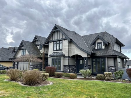 beautiful new house in city of Surrey near Vancouver Canada private sector clouds picture like from visualization magazine desire to have such mansion street trees built two-story cottage Canada 2023