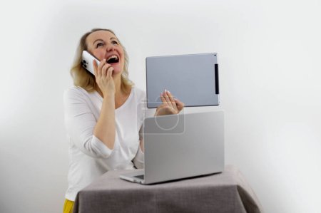 Photo for Woman sit on sofa put pc on lap clenched fists scream with joy while read great news on laptop. Gambler celebrate online auction bet victory. Got incredible offer sincere emotions of happiness - Royalty Free Image