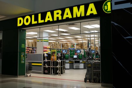 Photo for Dalarama store in the mall shopping everything for a dollar cheap prices cash registers entrance signboard name yellow letters on a dark background. Vancouver. Canada - Royalty Free Image