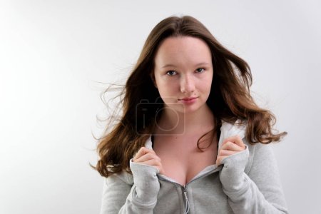 Photo for Young caucasian girl wearing casual sweatshirt hugging oneself happy and positive, smiling confident. self love and self care - Royalty Free Image