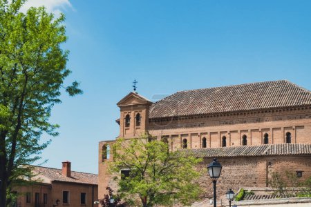 Foto de Toledo, Espaa. April 29, 2022: Domes and facade of city churches with blue sky. - Imagen libre de derechos