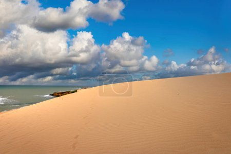 Arid landscape with sea and beautiful blue sky in the taroa dunes. Guajira, Colombia. 