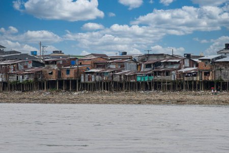 Choco, Quibdo, Colombia. March 4, 2020: Houses in the shore of the Atrato River with blue sky. 