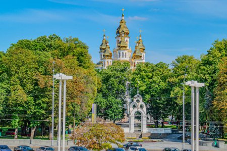 Photo for Mirror Stream fountain. White building with a distinctive gold roof in Kharkiv, Ukraine. The building stands out amidst surrounding greenery. city architecture. Kharkov, Ukraine 05-05-2023 - Royalty Free Image