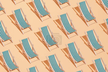 Photo for Sandy beach with sunbeds. Minimal concept of summer and vacation in the tropics by the sea. Trendy collage on pastel yellow background.Creative art minimal aesthetic - Royalty Free Image