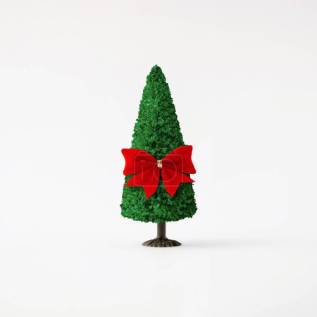 Photo for Christmas tree with red bow on light background. Minimal holiday concept. New year simple composition. Merry Christmas and happy New Year greeting card. - Royalty Free Image