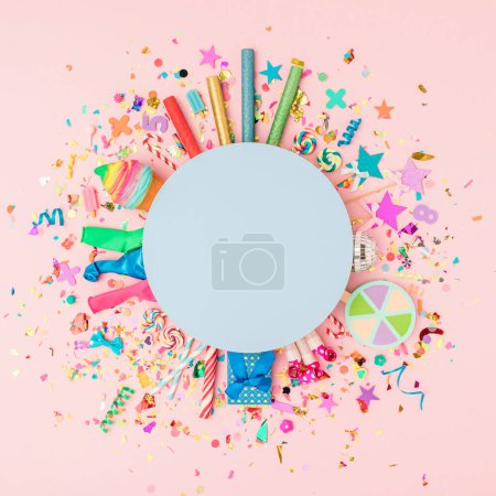 Photo for Colorful background for the celebration with various confetti, balloons, ribbons, fireworks and decorations on a pink background. Flat lai. Minimal concept of a celebration invitation. Copy space - Royalty Free Image