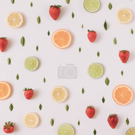 Photo for Colorful pattern made of citrus fruits, leaves and strawberries - Royalty Free Image