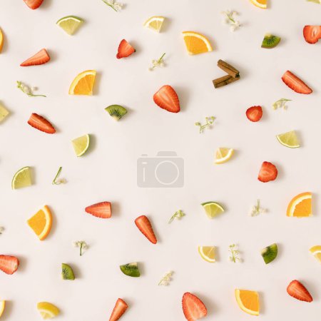 Photo for Colorful pattern made of citrus fruits, leaves and strawberries. - Royalty Free Image
