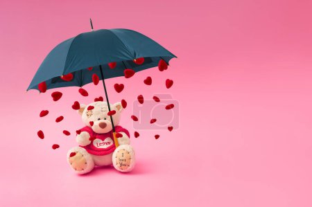 Photo for Love composition made of teddy bear, umbrella and rain in the shape of a heart on pastel pink background. Minimal concept of Valentine's Day or love. Creative art, minimal aesthetics. - Royalty Free Image