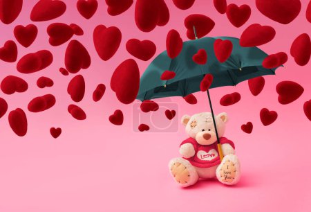 Téléchargez les photos : Composition d'amour faite d'ours en peluche, parapluie et pluie en forme de coeur sur fond rose pastel. Concept minimal de Saint-Valentin ou d'amour. Art créatif, esthétique minimale. - en image libre de droit