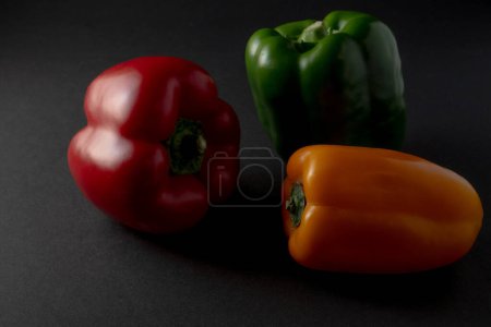 colorful vegetables paprika chili on black background