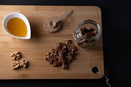 pecan nuts on wooden background food photography international pecan day