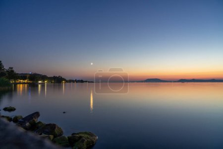 Photo for Sunset at Lake Balaton with the north part mountains in the background . - Royalty Free Image