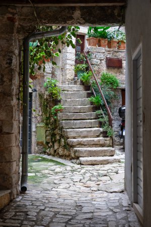 beautiful street of Rovinj Croatia with cobblestone and stairway .