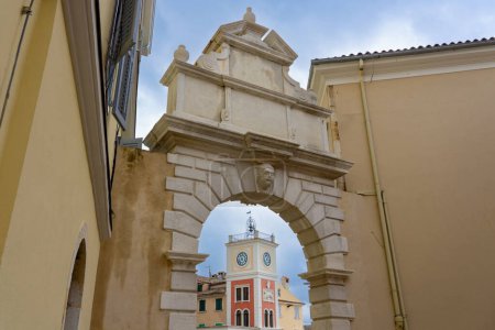 balbis arch with town clock tower next to Tito square in Rovinj Croatia .