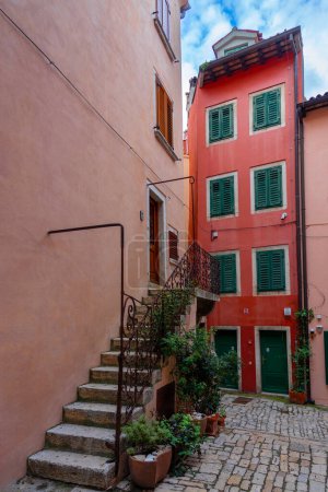 beautiful colorful street of Rovinj Croatia with cobblestone and stairway .