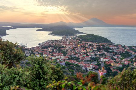 scenic view of the croatian losinj islands in the kvarner gulf at sunset from above with sunbeam .