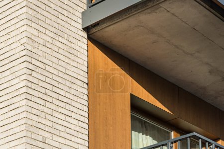 Photo for Detail for a multifamily building in the city center. Large number of floors. Balconies and loggias. - Royalty Free Image