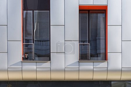 Photo for Colorful detail for the facade of the object, building. Material of vertical aluminum and orange panels. Modern building. Windows - Royalty Free Image