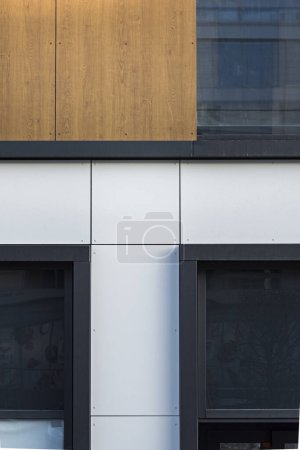 Photo for Detail for a modern multifamily building in the city center. Large number of floors. Balconies and loggias. Sunny weather - Royalty Free Image