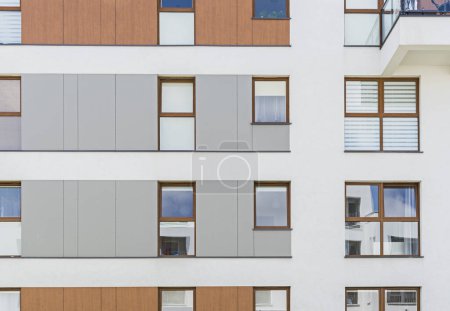 Photo for Detail for a modern multifamily building in a European city. Interesting arrangement of windows and material - Royalty Free Image