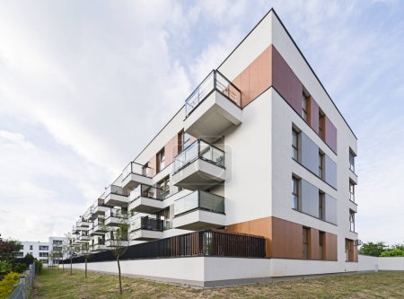 Modern multifamily building in a European city. Harmonious arrangement of balconies