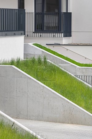 Detail on walkways made of concrete in a modern multifamily building in a European city.